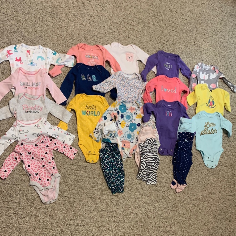 Lot of newborn onesies and pants